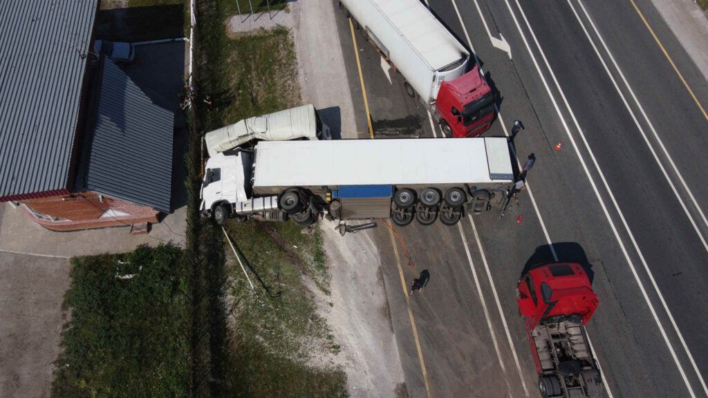 Texas truck accident lawyer reviewing serious semi-truck crash involving multiple commercial vehicles on a Texas highway