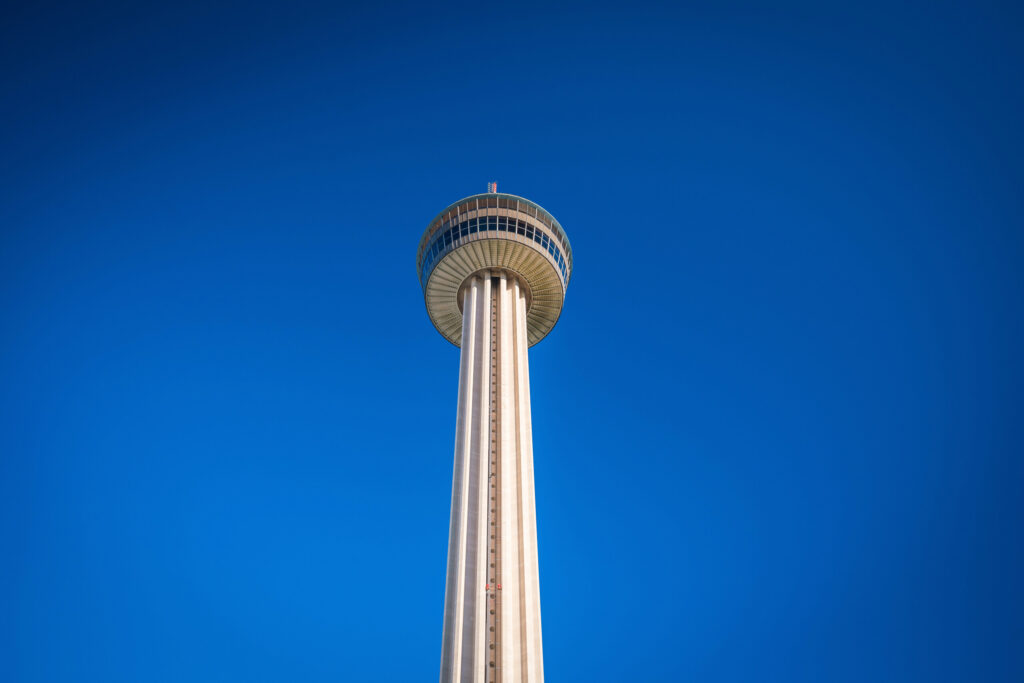 The Tower of the Americas stands tall against a clear blue sky, signifying the local service region of San Antonio Burn Injury Lawyers.