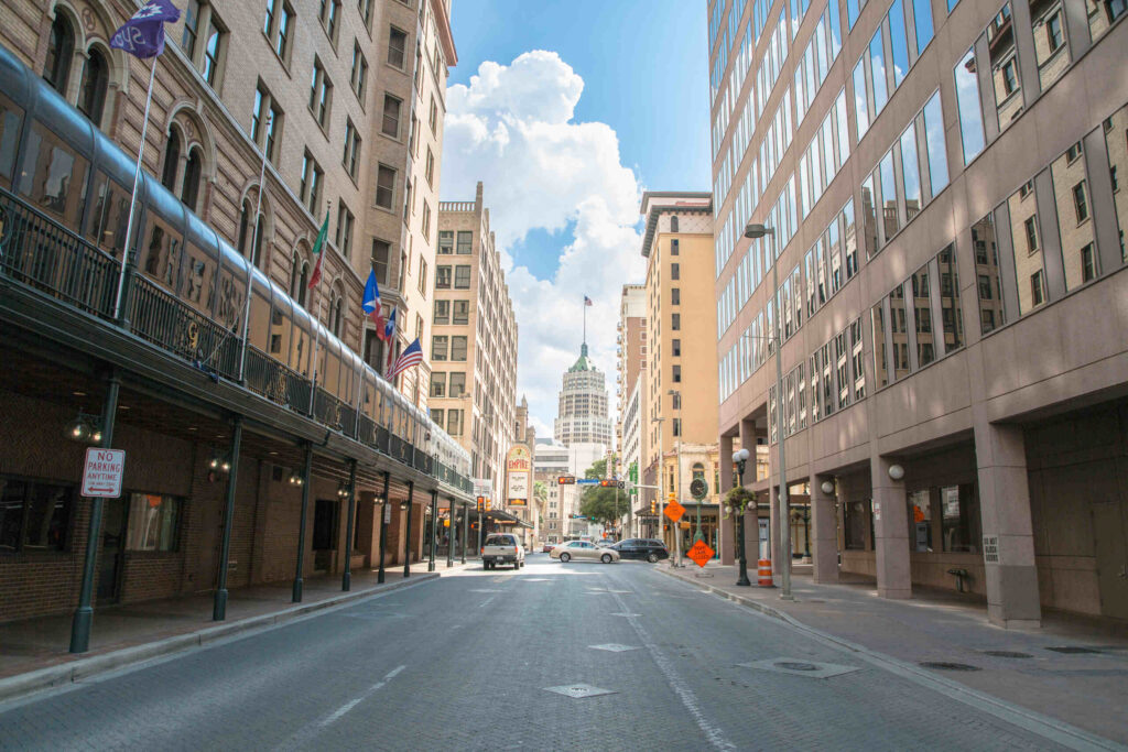 A street-level view of downtown San Antonio buildings under a blue sky, representing the legal service area for Texas Hit and Run Accident Lawyers.
