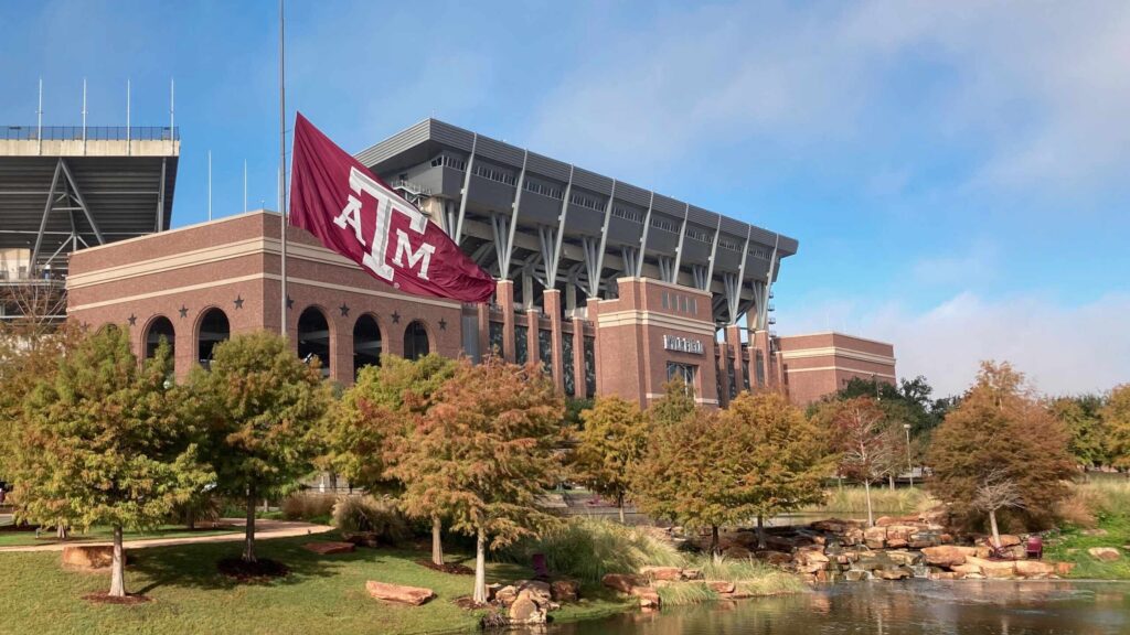 Kyle Field with a Texas A&M flag waving in the foreground highlights the location of car accidents on Texas A&M Game Days in College Station.